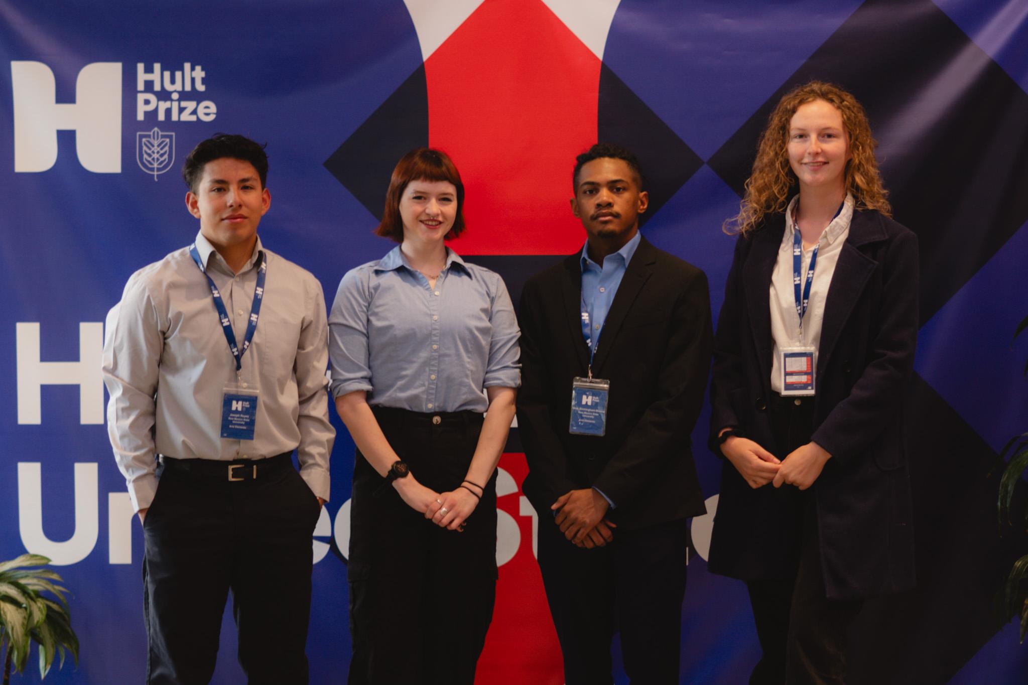 Group photo of four people.
